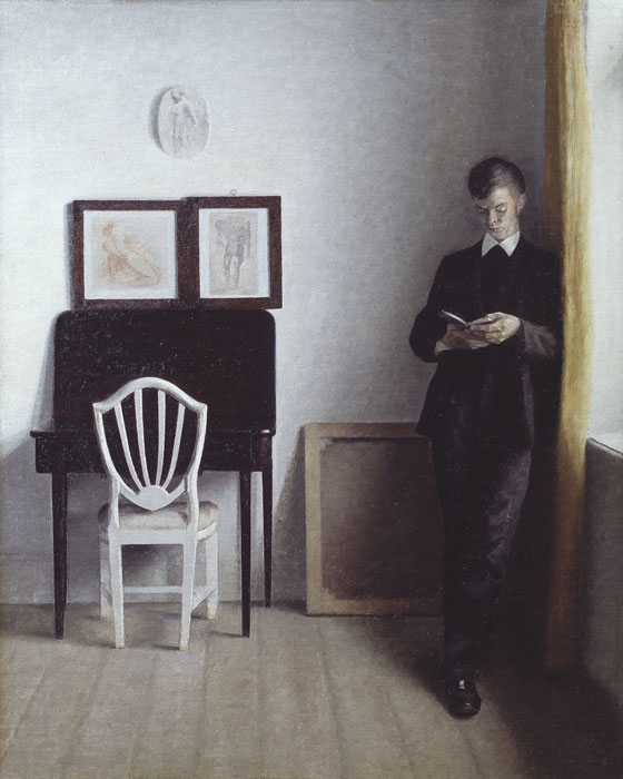 Vilhelm Hammershøi (1864-1916), Interior with a Young Man Reading